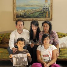 The Funk family, Sharaf (left) and Mahnaz, along with their children Jinan, 14, Shahd, 11, and Bahhaj, 8, are concerned about a relative who is in an Iranian prison. She is pictured at the far right in the photo that Bahhaj is holding.